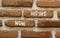 Now hiring symbol. Concept words Now hiring on beautiful brown bricks. Beautiful brick wall background. Beautiful brick wall.