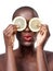 Now I definitely have a zest for life. Studio shot of a beautiful model holding lemon slices up to her eyes.