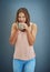 Now this is my cup of tea. Studio shot of a young woman drinking a beverage against a gray background.