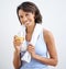 Now thats refreshing. Shot of a beautiful young woman enjoying a glass of fresh orange juice.