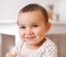 Now thats a smile. Portrait of an adorable baby girl at home.