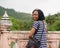 Now this is a view worth traveling for. Portrait of a happy young woman admiring the view while on vacation.