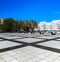 Nowy Targ square full of black and gray brick and metal sunbeds