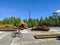 Noyabrsk, Russia - July 6, 2022: View of the new skate park for skateboarding and cycling, scooters, rollerblading. Boy rides a