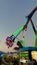 NPE Pleasure and leisure park for children and adults swings and attractions Evening lights on swing Scary creepy swing