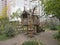 Nteresting wooden sculpture hut on chicken legs on the playground called `Good fairy tale`