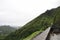 Nu`uanu Pali Lookout, one of the most popular attractions in Honolulu, with a man taking photos