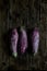 Nubia eggplants over a wooden table.