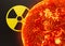 Nuclear energy radioactive round yellow symbol and nuclear explosion on black background. Ionizing atomic radiation