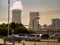 A nuclear power plant next to a motorway emits a plume of white smoke from its smokestack