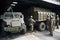 nuclear waste being transported in heavily armored vehicle, guarded by armed personnel