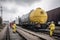 nuclear waste being transported on train, with security and emergency services in place