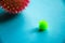 Nucleus, Coronavirus molecule. Flu virus of green and red color on a blue background. Flu vaccine, coronavirus. Copy Space. Covid-