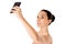 Nude beautiful woman taking selfie on white background.