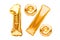 Number 1 one and percent sign made of golden helium inflatable balloons isolated on white. Gold foil numbers for use on