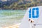 Number 10 (ten) painted in blue on holiday catamaran on Black Sea, Crimea