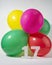 Number 17 and colourful round balloons. Birthday, anniversary, jubilee concept.