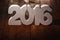 Number 2016 on wooden table background