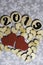 Number 2019 on wooden decor elements , wooden hearts and two red textile hearts on snowflake background.