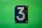 Number 3 sign - number three metal sign on green background