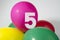 Number 5 and colourful round balloons. Birthday, anniversary, jubilee concept.