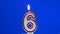 Number 6 - six birthday candle burning