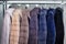 A number of dyed mink fur coats for catalog, different colors close-up