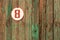 The number eight on the old wooden gate