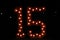 Number fifteen with lights on; fifteen illuminated; colorful number