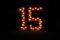 Number fifteen with lights on; fifteen illuminated; colorful number