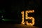 Number fifteen with lights on; fifteen illuminated; colorful number