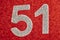 Number fifty-one silver over a red background. Anniversary. Horizontal