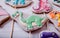Number of gingerbreads in shape of dinosaurs colored with different glaze