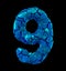 Number nine 9 made of broken plastic blue color isolated black background