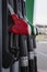 A number of pistols for refueling cars at gas stations. Vertical. Close-up