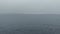 number of sailing boat in the water during a fogy day at the cost of ireland