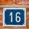 Number sixteen on a wall in a house