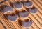 A number of tempting semilunar candied cookies lying on a metal grate