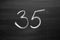 Number thirty five enumeration written with a chalk