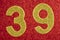 Number thirty-nine gold color over a red background. Anniversary