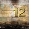 Number twelve on wooden background