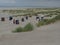 Numbered booths around the grass on the Juist island beach, Germany