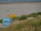 Numbered booths on the Juist island beach around grass, Germany