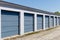 Numbered self storage and mini storage garage units with roll up doors