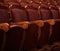 Numbered theater chairs with red velvet