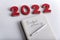 Numbers 2022 and notebook labeled BUDGET planning. Budget for 2022