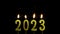 Numbers of the year 2023 made by gold sparkler candle number  isolated on black background