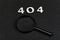 Numerals 404 and magnifying glass on black background. Error concept