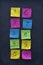 Numerals on colorful sticky notes and blackboard