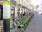 numerous bicycles for rent from the company GIRA parked and organized in parallel in downtown Lisbon